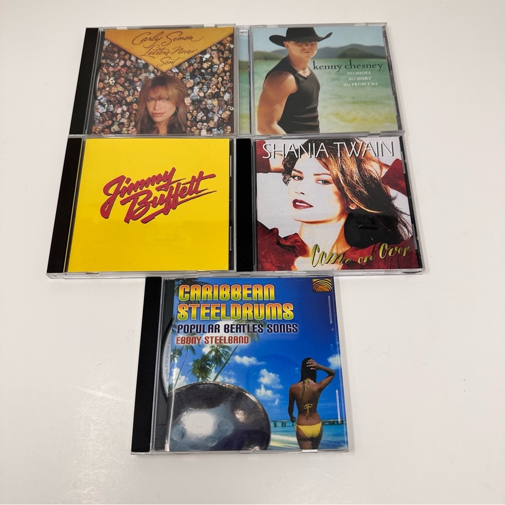 Bundle of 5 CD’s Carly Simon, Kenny Chesney, Jimmy Buffet, Shania, Steel Drums